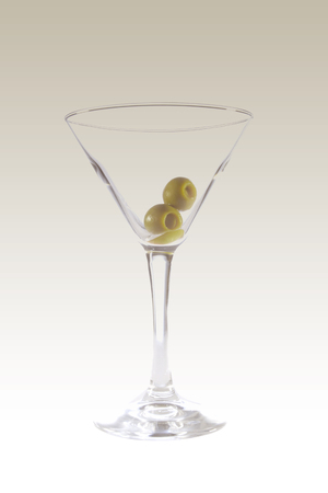 Empty glass with olives on white isolated backgroundの写真素材