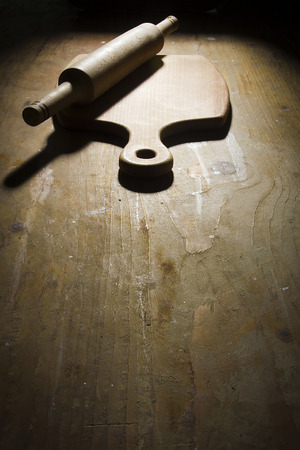 Cutting board on a wooden kitchen tableの写真素材