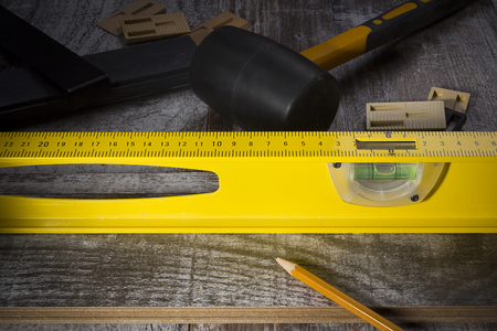 Instruments for installing laminate floor on laminate
