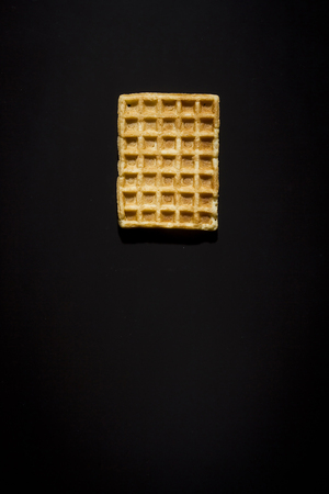 Fresh biscuit waffles on a black backgroundの写真素材