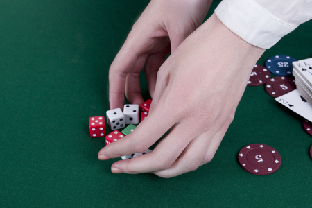 The hands of a croupier at the casino gaming tableの写真素材