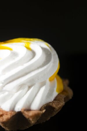 Cake Basket with cream and jam on a black background