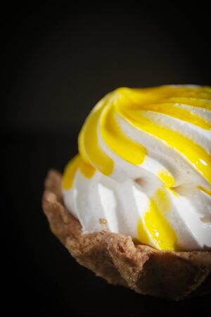 Cake Basket with cream and jam on a black backgroundの写真素材