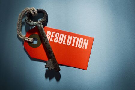 Red label with the word resolution and old keyの写真素材