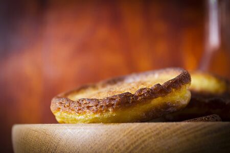 Hash browns in a wooden plate on a vintage table