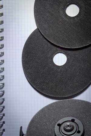 Disks for a grinder on a notebook in a cageの写真素材