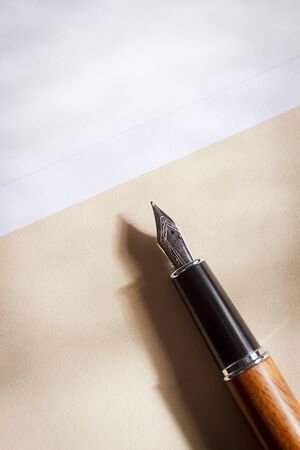 Fountain pen and envelope on the desktopの写真素材