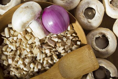 Ingredients for stuffing mushrooms on the kitchen table.の写真素材