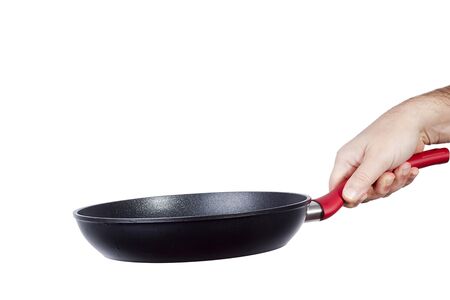Frying pan in a man's hand on a white backgroundの写真素材
