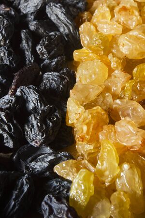Raisins light and dark as a backgroundの写真素材