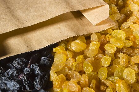 Raisins light and dark as a backgroundの写真素材