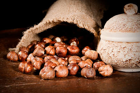 Unpeeled hazelnuts in a bag close up