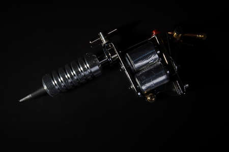 Tattoo machine for applying tattoo on black background