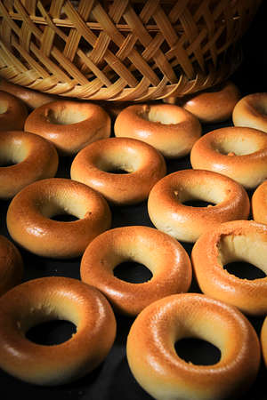 Wicker basket with ring-shaped cookies close upの写真素材