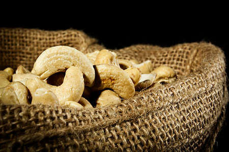 Cashew nuts in a bag close upの写真素材