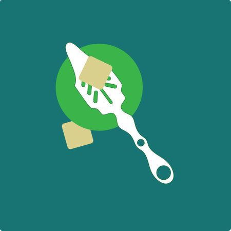 Spoon for a strong alcoholic drink absinthe over a glass with a piece of sugar.のイラスト素材