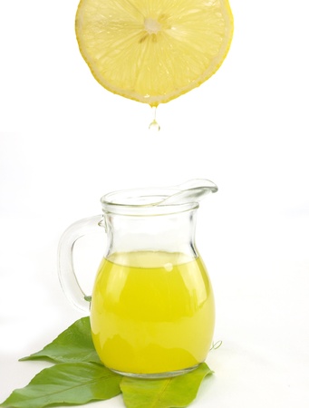 Jug of a fresh lemon juice with lemon fruit      の写真素材