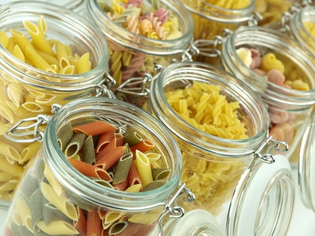 Glass jar filled with various pastaの写真素材
