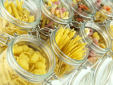 Glass jar filled with various pastaの写真素材