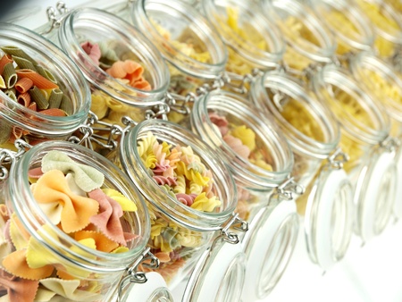 Glass jar filled with various pastaの写真素材
