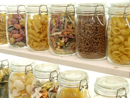 Glass jar filled with various pastaの写真素材