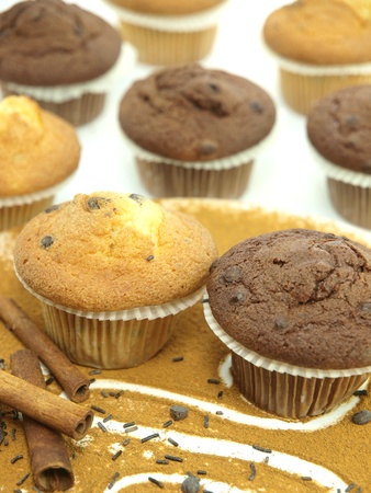 Fresh baked muffins over the cinnamonの写真素材