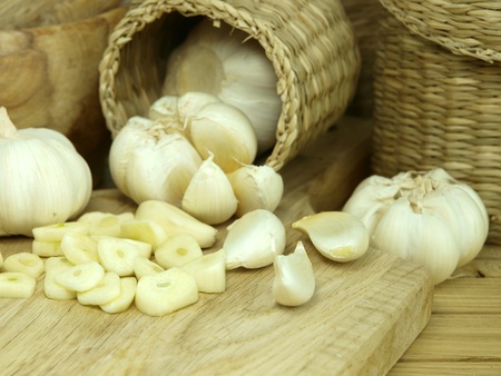 Garlic pods over wooden tableの写真素材