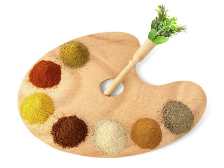 Herbs and spices on a wooden palette の写真素材