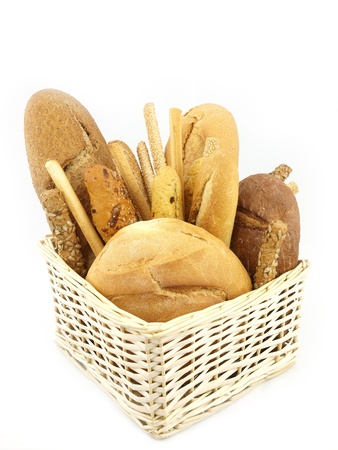Various types of bread and other wheat products in the basketの写真素材