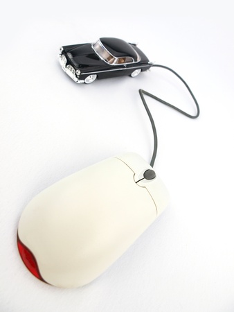 A car connected to a computer mouse の写真素材