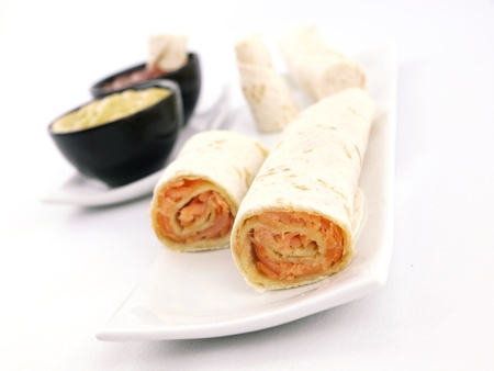 Tortilla wrap with salmon on a plateの写真素材