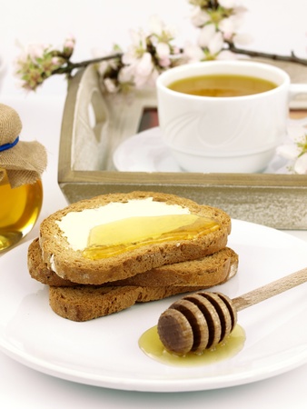 Honey on toast, with a breakfast set backgroundの写真素材