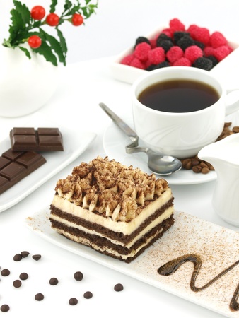 Tiramisu dessert and a cup of coffee on a table の写真素材