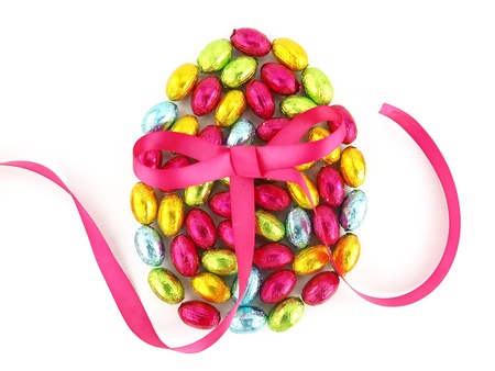 Chocolate Easter eggs in colorful foil with a bow 