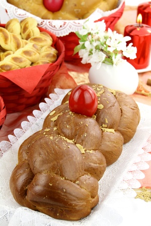 A traditional sweet brioche bread, called tsoureki, decorated with red eggs (Greek recipe) の写真素材