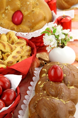 A traditional sweet brioche bread, called tsoureki, decorated with red eggs (Greek recipe) の写真素材