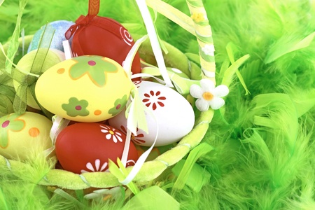 Colorful Easter eggs in a basket の写真素材