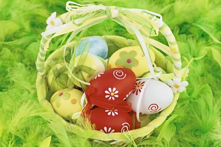 Colorful Easter eggs in a basket の写真素材