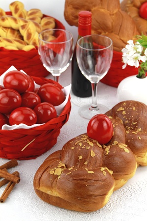 A traditional sweet brioche bread, called tsoureki, decorated with red eggs (Greek recipe) の写真素材