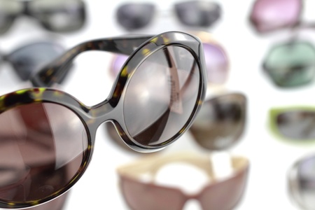 A pair of sunglasses with glasses backgroundの写真素材