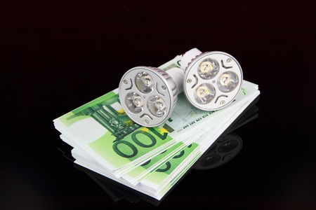 LED light bulbs with moneyの写真素材