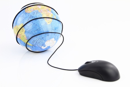 Computer mouse wraps the world globeの写真素材