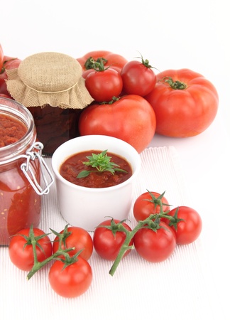 Tomato sauce and fresh tomatoesの写真素材