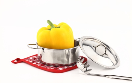 Fresh yellow pepper inside a pot の写真素材