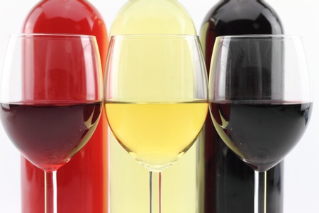 Three colors of wine in bottles and glasses の写真素材