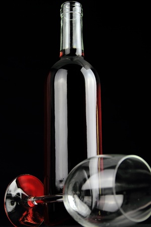 Bottle of red wine and a crystal wineglass の写真素材
