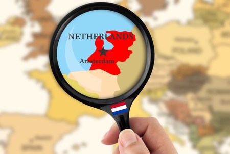 Magnifying glass over a map of Netherlandsの写真素材