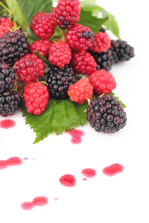 Juicy fresh raspberries and blackberriesの写真素材