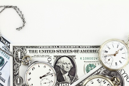 Antique pocket clocks and moneyの写真素材