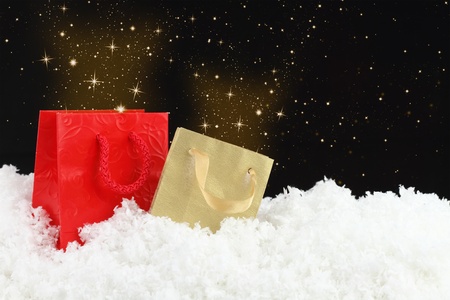 Magic christmas Shopping bags on snowの写真素材
